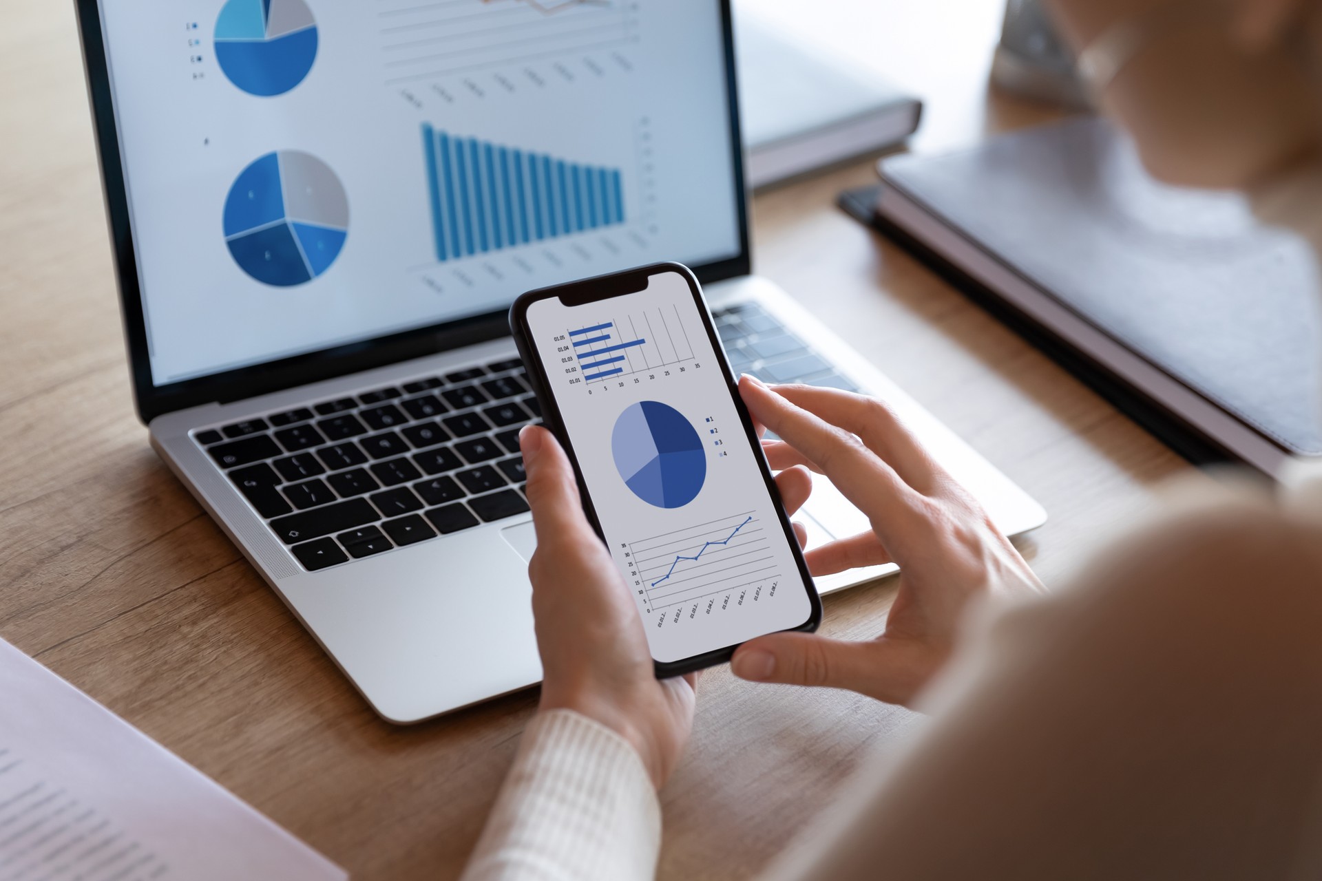 Close up of female employee analyze financial graphs